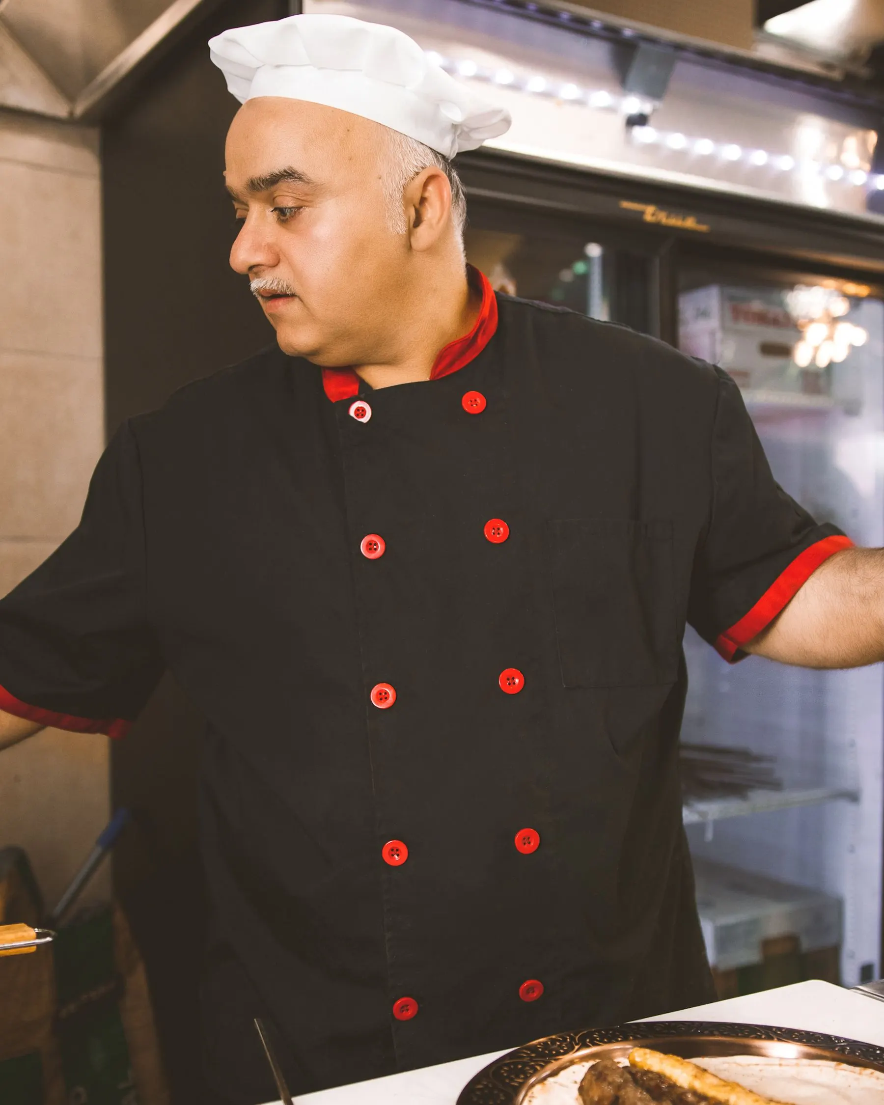 F&B analyst Ivan Petrov in a dark chef's jacket